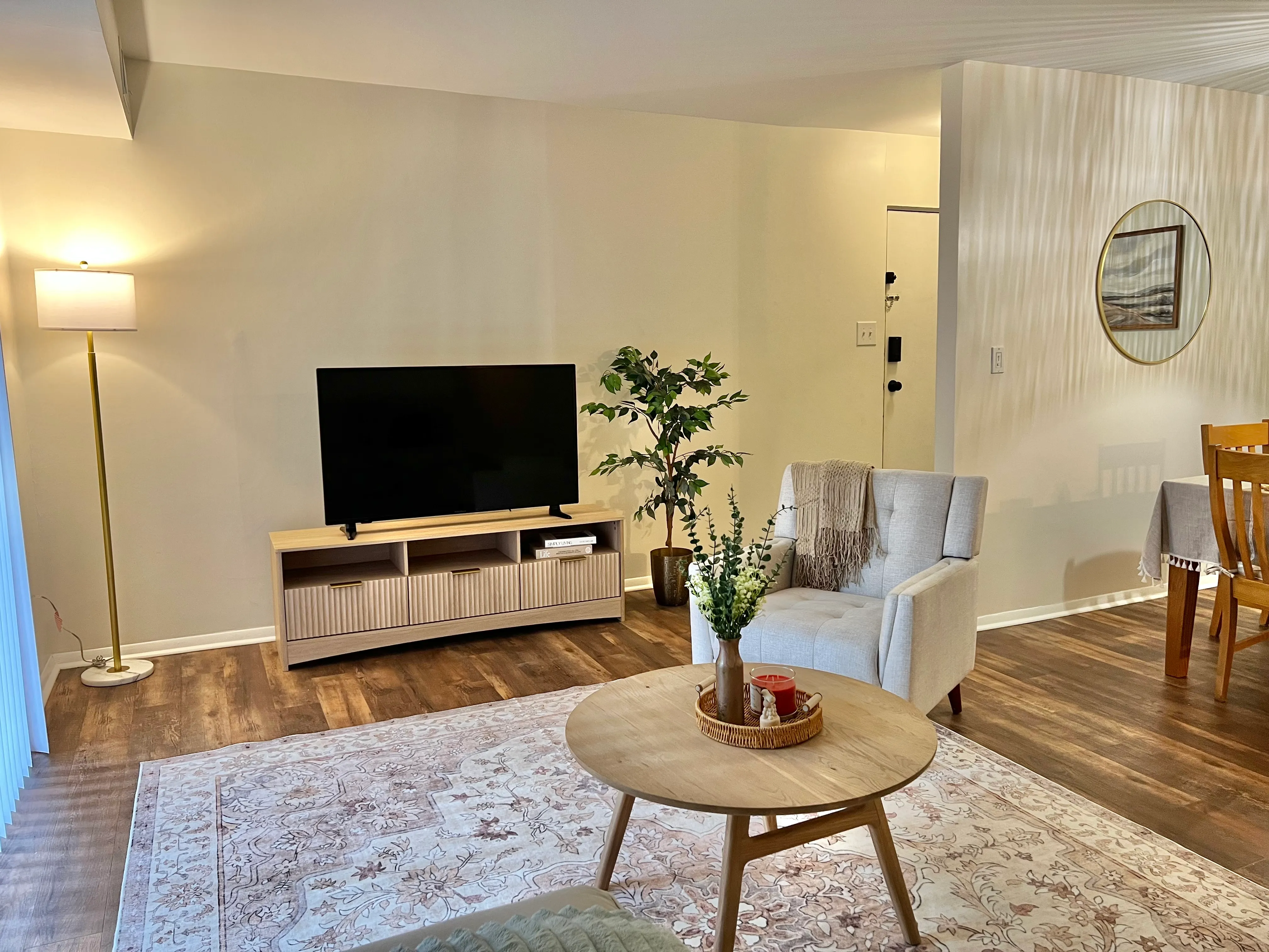 Living room from the entry, showing the TV console and reading chair